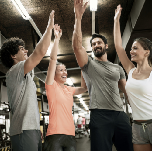 Black and white photo of a women performing modern dance on a dark background.